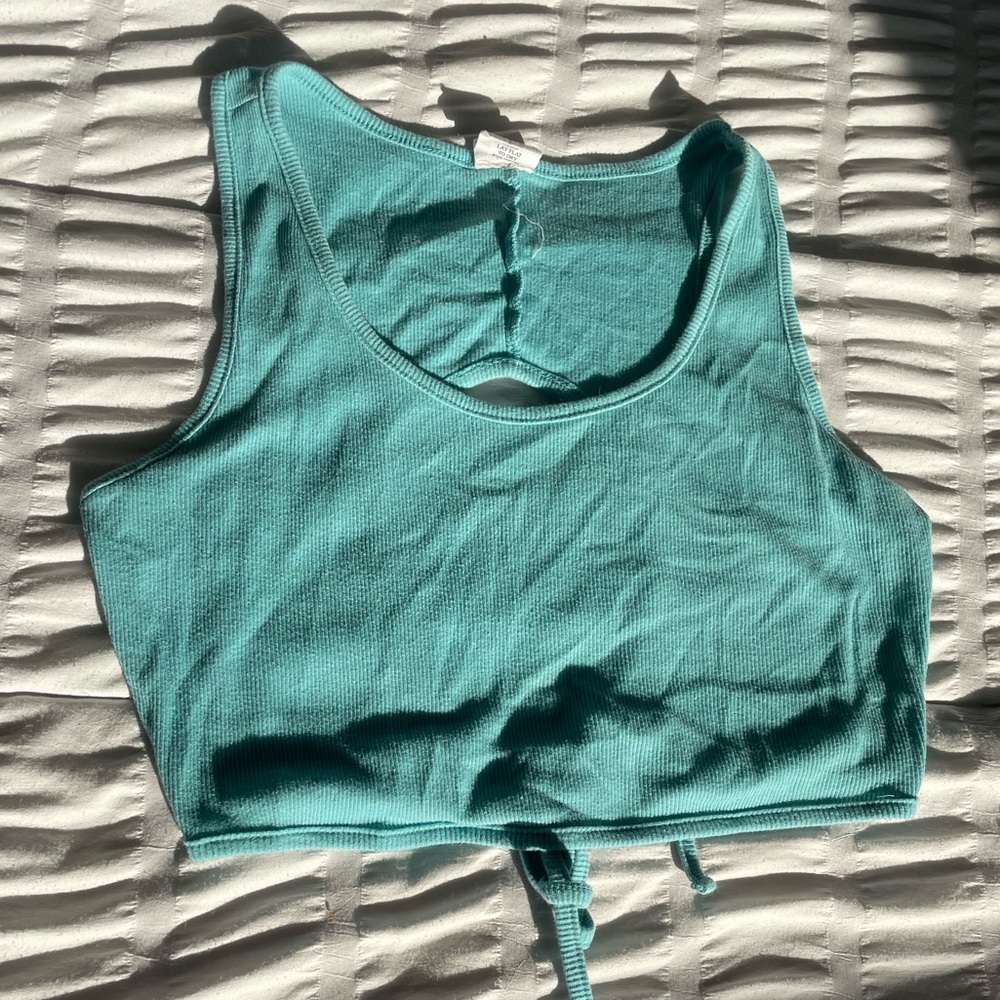 Teal crop top with an open back and ties in the back